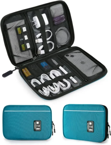 A blue BAGSMART cable organizer bag with a mesh pocket and zipper closure, lying open on a desk. It holds various tech accessories like charging cables, a USB drive, an SD card, and earbuds, all kept organized by elastic loops and mesh compartments.