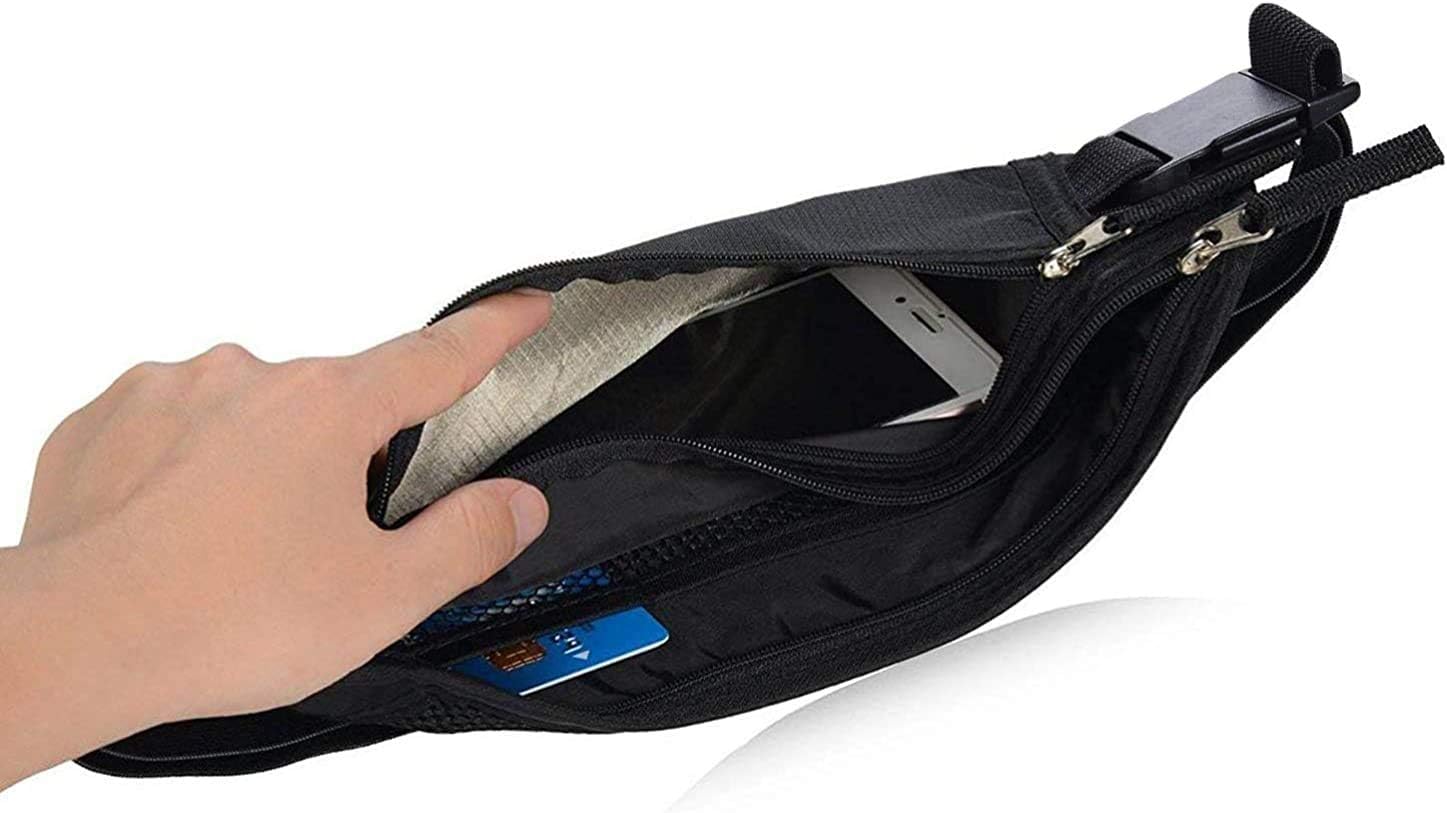 Hand holding open RFID blocking travel wallet, revealing interior compartments with phone and credit cards.